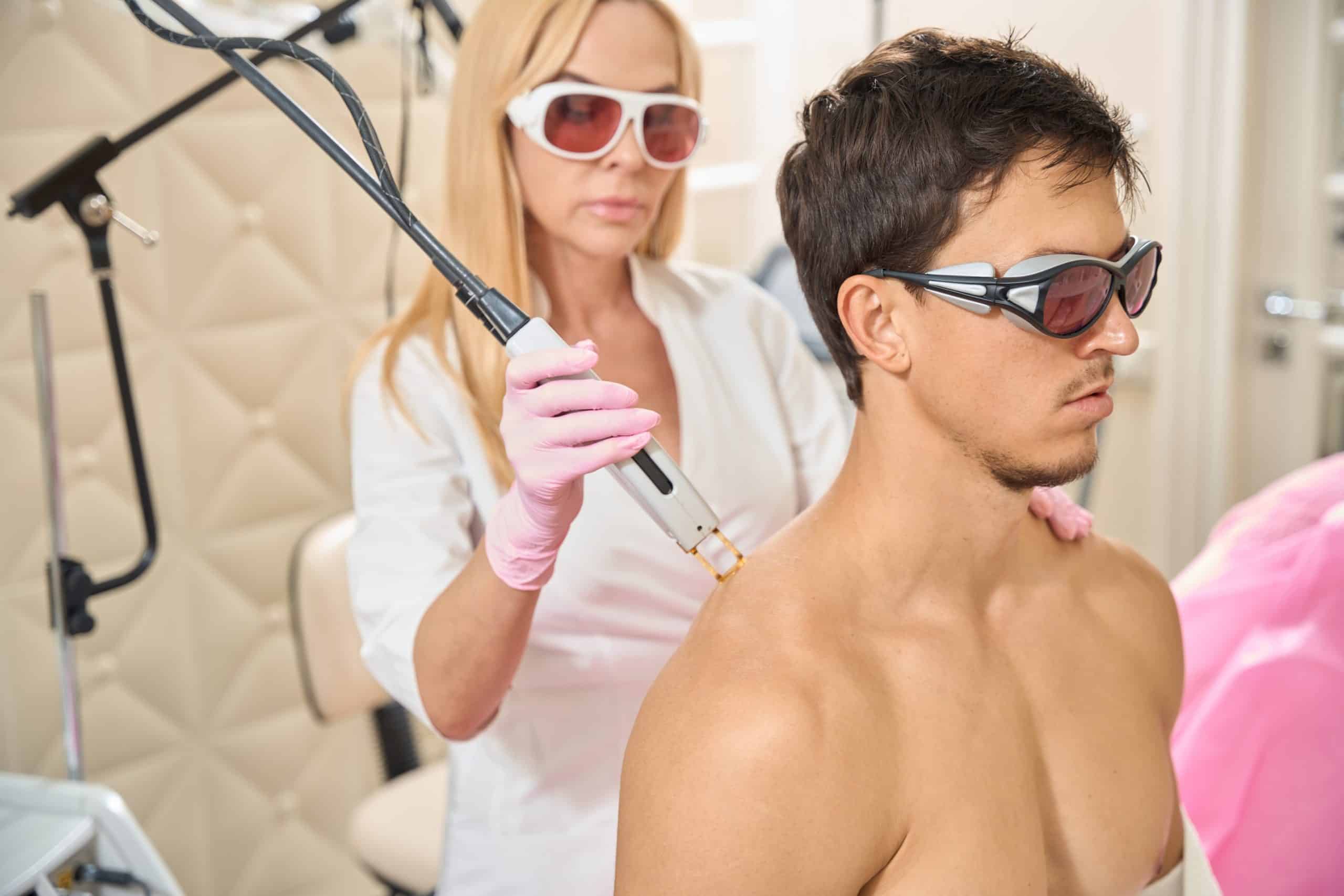 male getting laser hair removal