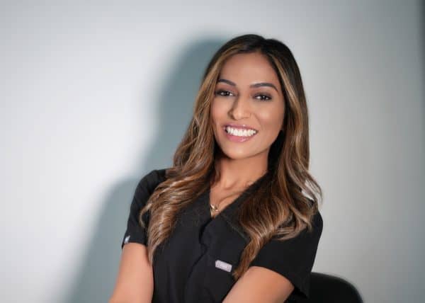 Smiling woman in black shirt, professional portrait