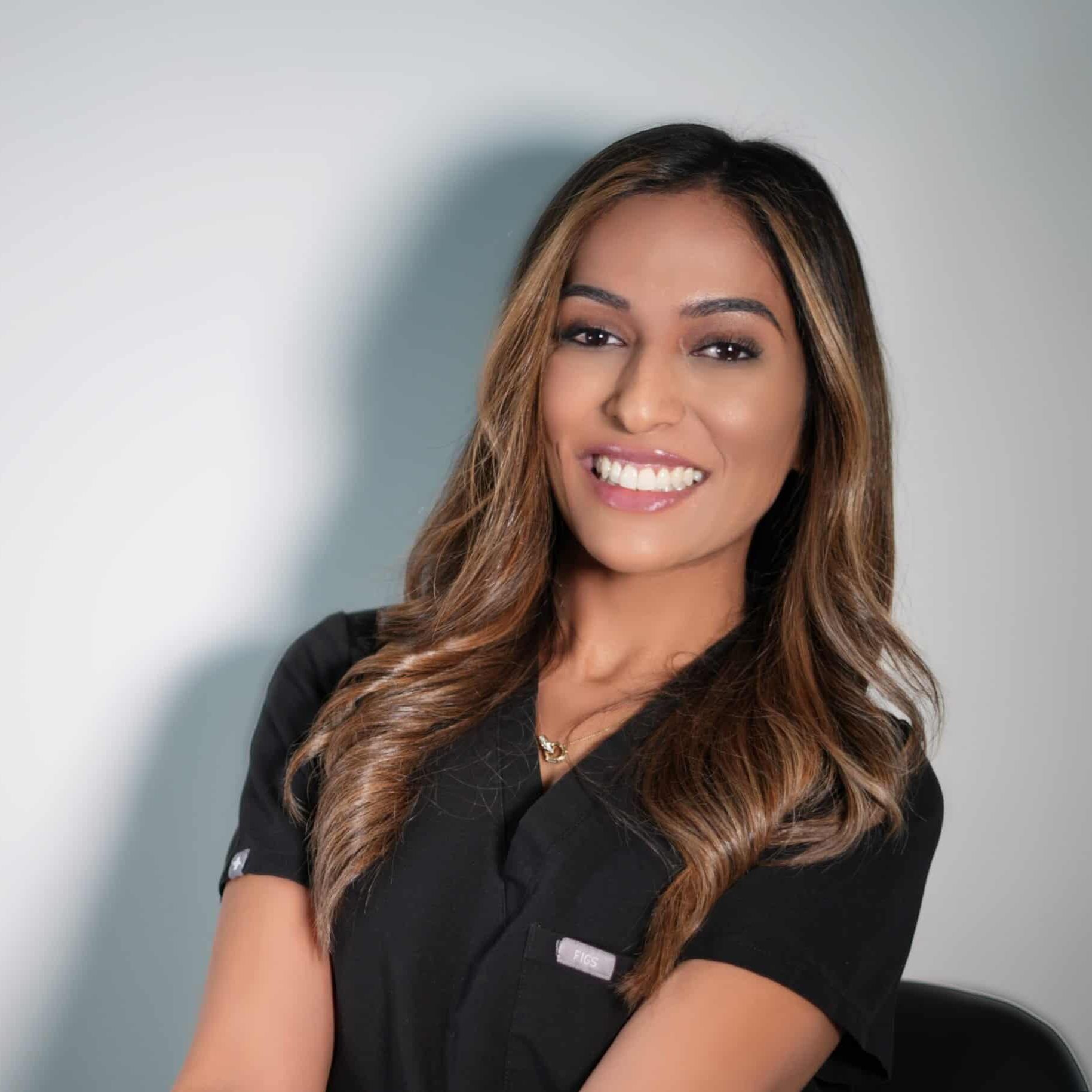 Smiling woman in black shirt, professional portrait