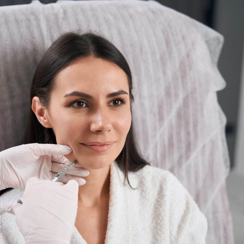 example 3 Woman receiving cosmetic injection at clinic
