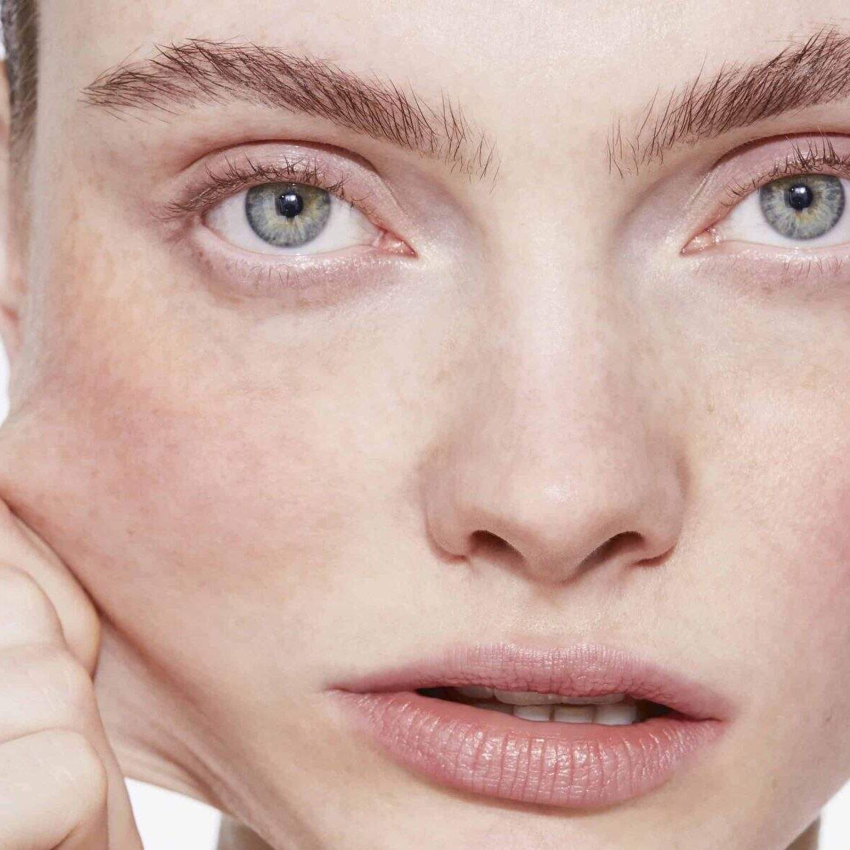 Close-up of person's face with skin pull