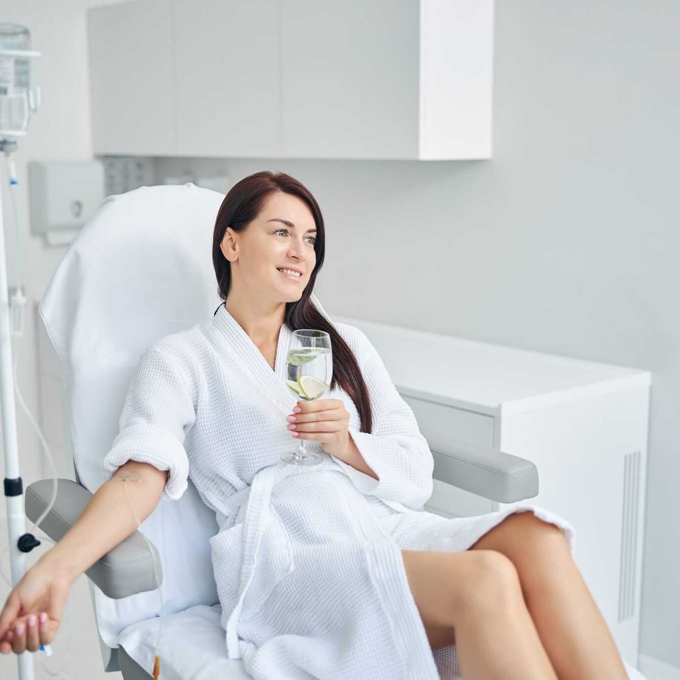happy adult patient relaxing during the intravenous therapy happy adult patient relaxing during the intravenous therapy