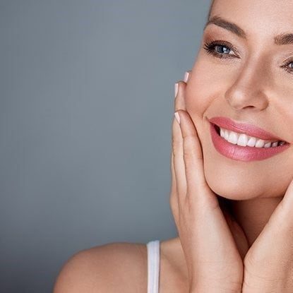 Smiling woman with flawless skin and bright smile